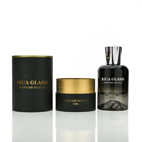 HUA0148 perfume bottle, cylindrical customizable gradient glass body with mountain-shaped base, 30 ml, 50 ml, or 100 ml liquid, irregular cylindrical cap with raised top in gold or silver, outer label with printed logo, modern elegant design, ideal for gifting and daily use.