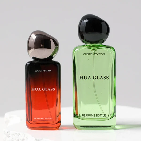 HUA0151 perfume bottle, rectangular customizable gradient glass body with 30 ml, 50 ml, or 100 ml liquid, asymmetrical rounded plastic cap, outer label with printed logo, modern elegant design, ideal for gifting and daily use.