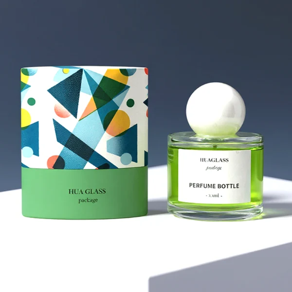 HUA0157 perfume bottle, cylindrical clear glass body with 30 ml, 50 ml, or 100 ml liquid, spherical crystal stone cap, outer label with printed logo, modern elegant design, ideal for gifting and daily use.