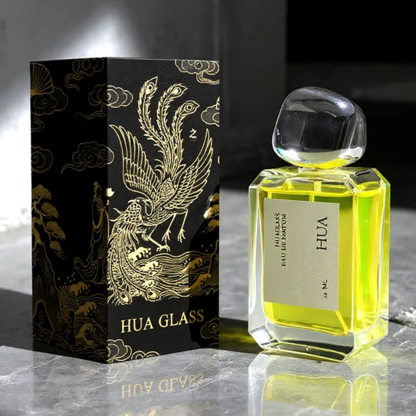 HUA0160 perfume bottle, rectangular clear glass body with 30 ml, 50 ml, or 100 ml liquid, irregular rounded plastic cap, outer label with printed logo, modern elegant design, ideal for gifting and daily use.