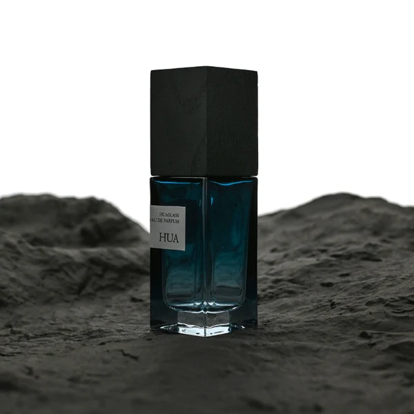 HUA0163 perfume bottle, rectangular gradient glass body with 30 ml, 50 ml, or 100 ml liquid, tall square wooden cap, outer label with printed logo, modern elegant design, ideal for gifting and daily use.