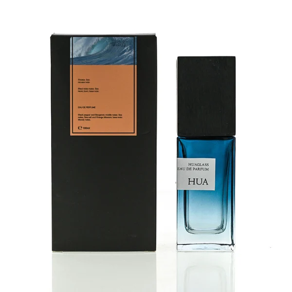 HUA0163 perfume bottle, rectangular gradient glass body with 30 ml, 50 ml, or 100 ml liquid, tall square wooden cap, outer label with printed logo, modern elegant design, ideal for gifting and daily use.
