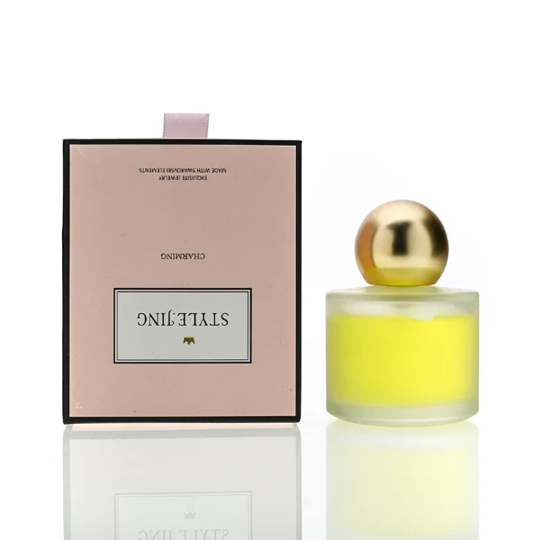 HUA0164 perfume bottle, cylindrical frosted glass body with 30 ml, 50 ml, or 100 ml liquid, spherical gold-colored plastic cap, outer label with printed logo, modern elegant design, ideal for gifting and daily use.