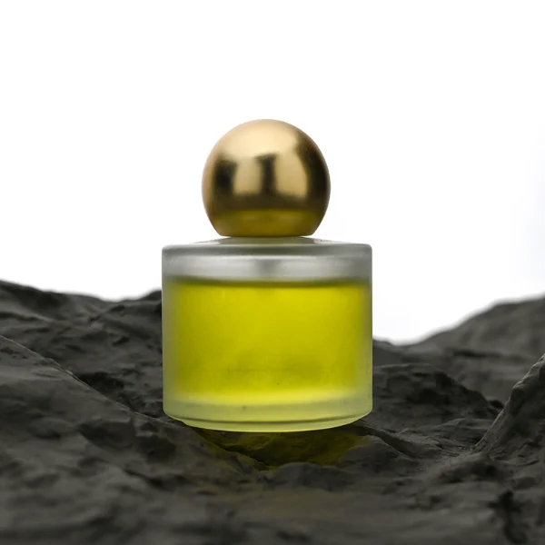 HUA0164 perfume bottle, cylindrical frosted glass body with 30 ml, 50 ml, or 100 ml liquid, spherical gold-colored plastic cap, outer label with printed logo, modern elegant design, ideal for gifting and daily use.