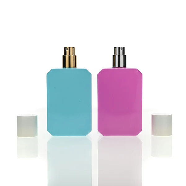 HUA0169 perfume bottle, octagonal solid-color glossy sprayed glass body with customizable color, 30 ml, 50 ml, or 100 ml liquid, cylindrical plastic cap with gold or silver neck ring, smooth glossy spray coating, modern minimalist design, ideal for gifting and daily use.