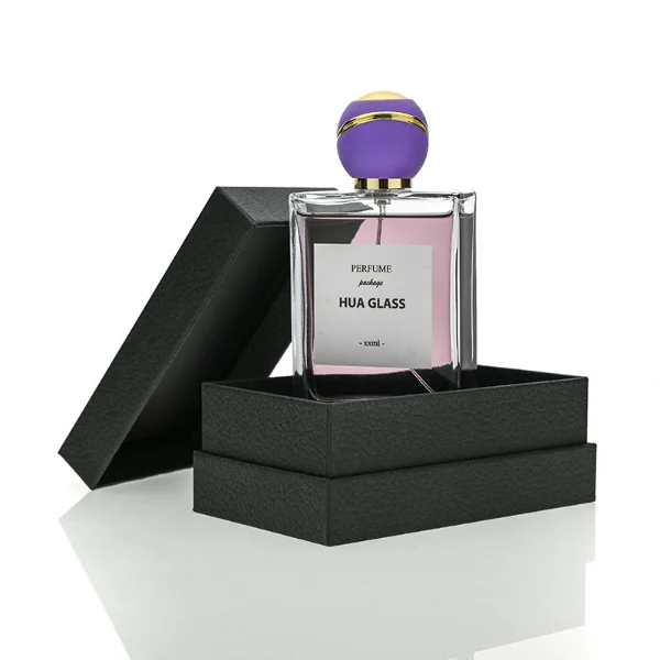 HUA0171 perfume bottle, rectangular transparent glass body with 30 ml, 50 ml, or 100 ml liquid, spherical plastic cap with diagonal gold stripe detailing and gold neck ring, outer label with printed logo, modern elegant design, ideal for gifting and daily use.