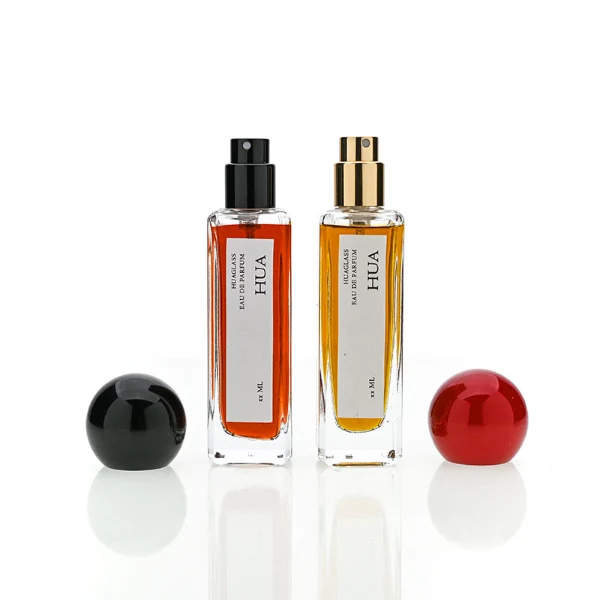 HUA0177 perfume bottle, slim rectangular transparent glass body with 30 ml, 50 ml, or 100 ml liquid, glossy spherical plastic cap with customizable colors, printed vertical logo label, modern minimalist elegant design, ideal for gifting and daily use.