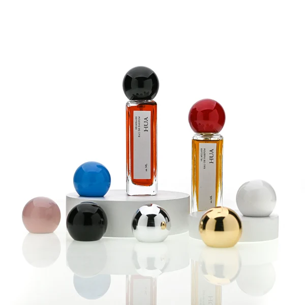 HUA0177 perfume bottle, slim rectangular transparent glass body with 30 ml, 50 ml, or 100 ml liquid, glossy spherical plastic cap with customizable colors, printed vertical logo label, modern minimalist elegant design, ideal for gifting and daily use.