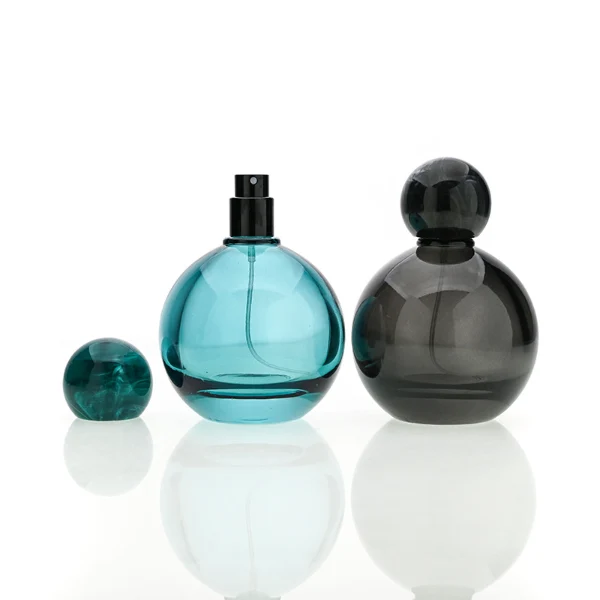 HUA0180 perfume bottle, round gourd-shaped glass body with customizable transparent colors, 30 ml, 50 ml, or 100 ml liquid, glossy spherical plastic cap with customizable colors, custom printed logo, modern playful elegant design, ideal for gifting and daily use.