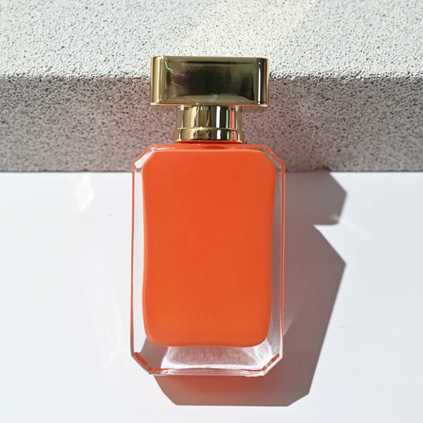 HUA0188 perfume bottle, rectangular inner-printed glass body with beveled edges, 30 ml, 50 ml, or 100 ml liquid, rectangular glossy plastic cap with gold or silver neck and customizable colors, printed logo with private imprint, modern minimalist luxury design, ideal for gifting and daily use.