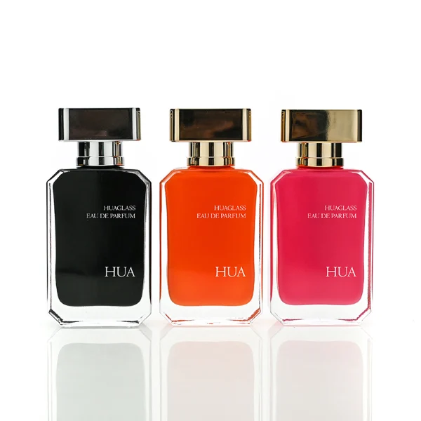 HUA0188 perfume bottle, rectangular inner-printed glass body with beveled edges, 30 ml, 50 ml, or 100 ml liquid, rectangular glossy plastic cap with gold or silver neck and customizable colors, printed logo with private imprint, modern minimalist luxury design, ideal for gifting and daily use.