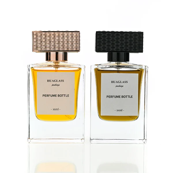 HUA0189 perfume bottle, rectangular transparent glass body with 50 ml liquid, rectangular textured plastic cap with customizable color matching the neck, printed logo label, modern premium luxury design, ideal for gifting and daily use.