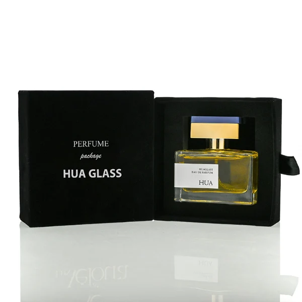 HUA0190 perfume bottle, rectangular transparent glass body with 50 ml liquid, rectangular plastic cap with customizable color matching the neck, printed logo label, modern premium luxury design, ideal for gifting and daily use.