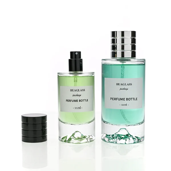 HUA0193 perfume bottle, cylindrical transparent glass body, 30 ml, 50 ml, or 100 ml liquid, cylindrical plastic cap with decorative rings on both ends in gold, black, or silver, printed logo label, modern minimalist luxury design, ideal for gifting and daily use.