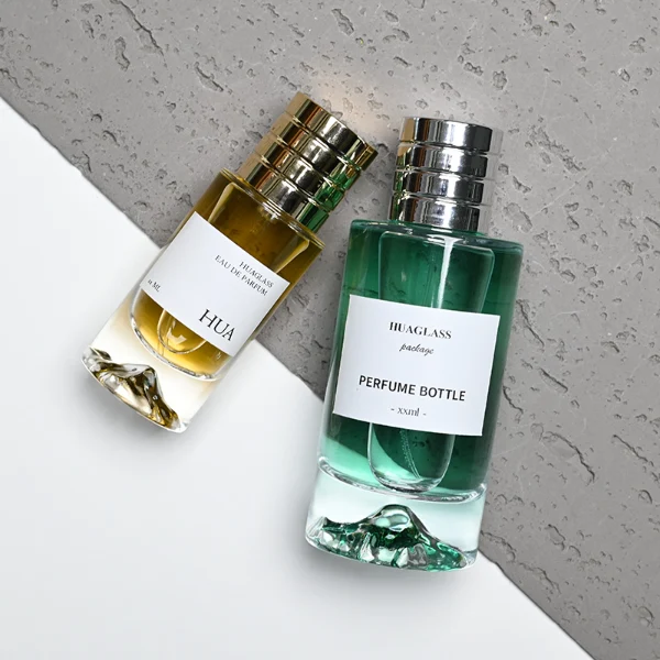 HUA0193 perfume bottle, cylindrical transparent glass body, 30 ml, 50 ml, or 100 ml liquid, cylindrical plastic cap with decorative rings on both ends in gold, black, or silver, printed logo label, modern minimalist luxury design, ideal for gifting and daily use.