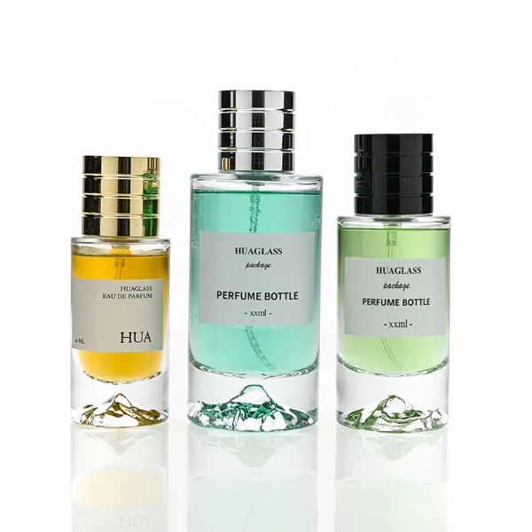 HUA0193 perfume bottle, cylindrical transparent glass body, 30 ml, 50 ml, or 100 ml liquid, cylindrical plastic cap with decorative rings on both ends in gold, black, or silver, printed logo label, modern minimalist luxury design, ideal for gifting and daily use.