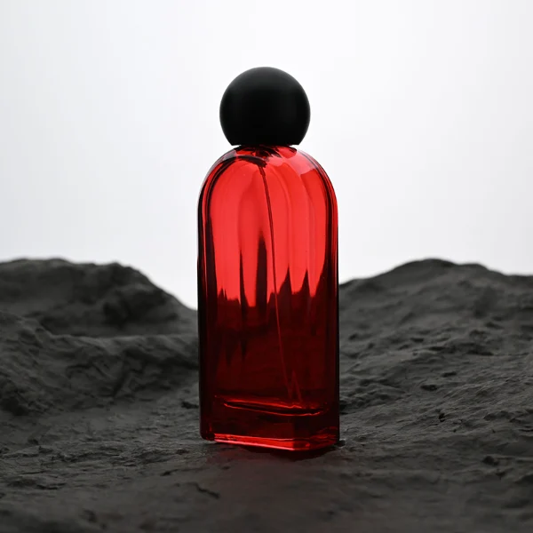 HUA0194 perfume bottle, rounded rectangular transparent glass body with customizable colors, 30 ml, 50 ml, or 100 ml liquid, black spherical plastic cap, private printed logo, modern minimalist design, ideal for gifting and daily use.