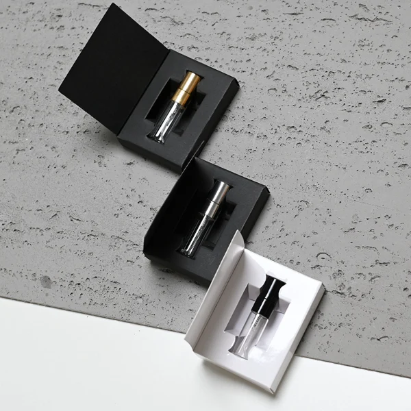 HUA0197 perfume bottle, slim cylindrical transparent glass body with 2 ml, 3 ml, 5 ml, or 10 ml liquid, black, gold, or silver aluminum spray cap with protective cover, compact and practical design, ideal for travel and sample use.