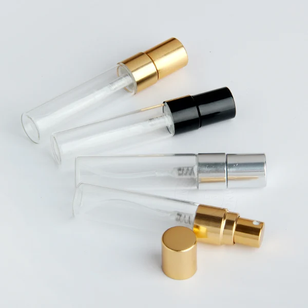 HUA0197 perfume bottle, slim cylindrical transparent glass body with 2 ml, 3 ml, 5 ml, or 10 ml liquid, black, gold, or silver aluminum spray cap with protective cover, compact and practical design, ideal for travel and sample use.