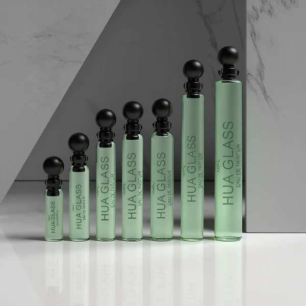 HUA0198 perfume bottle, slim cylindrical transparent glass body with 0.5 ml, 1 ml, 1.5 ml, 2 ml, 3 ml, or 5 ml liquid, black or white protective spherical plastic cap, Corrugated Plastic closure, printed logo, compact and practical design, ideal for travel and sample use.