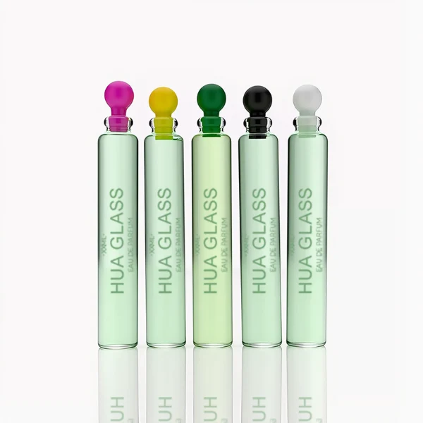 HUA0198 perfume bottle, slim cylindrical transparent glass body with 0.5 ml, 1 ml, 1.5 ml, 2 ml, 3 ml, or 5 ml liquid, black or white protective spherical plastic cap, Corrugated Plastic closure, printed logo, compact and practical design, ideal for travel and sample use.