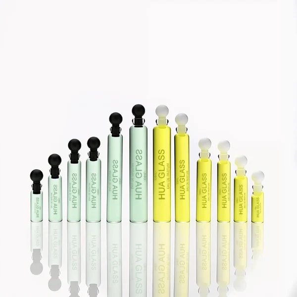 HUA0198 perfume bottle, slim cylindrical transparent glass body with 0.5 ml, 1 ml, 1.5 ml, 2 ml, 3 ml, or 5 ml liquid, black or white protective spherical plastic cap, Corrugated Plastic closure, printed logo, compact and practical design, ideal for travel and sample use.