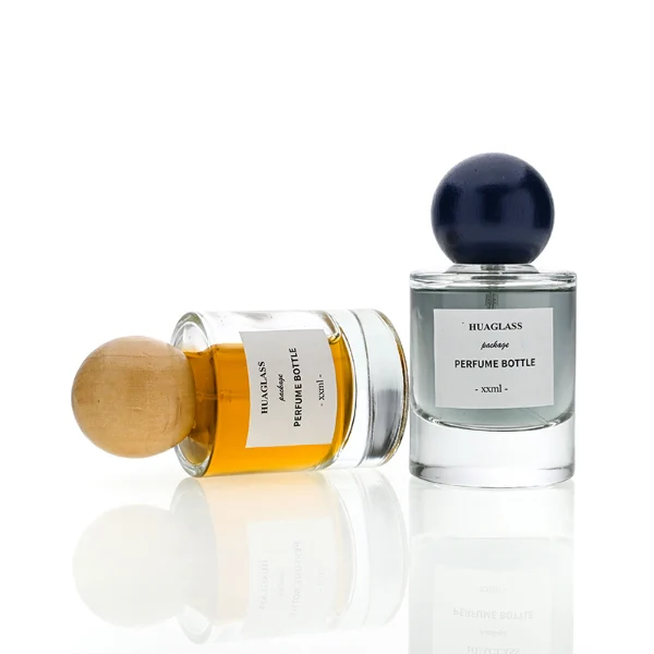 HUA0200 perfume bottle, cylindrical matte solid-color sprayed glass body with 30 ml, 50 ml, or 100 ml liquid, spherical resin cap with marble pattern, private printed logo, modern luxurious design, ideal for gifting and daily use.