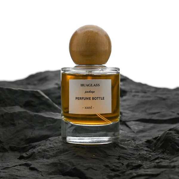 HUA0200 perfume bottle, cylindrical matte solid-color sprayed glass body with 30 ml, 50 ml, or 100 ml liquid, spherical resin cap with marble pattern, private printed logo, modern luxurious design, ideal for gifting and daily use.