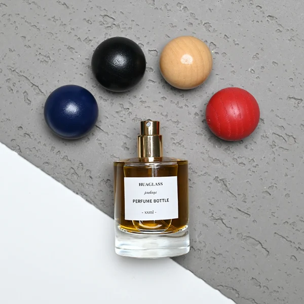 HUA0200 perfume bottle, cylindrical matte solid-color sprayed glass body with 30 ml, 50 ml, or 100 ml liquid, spherical resin cap with marble pattern, private printed logo, modern luxurious design, ideal for gifting and daily use.
