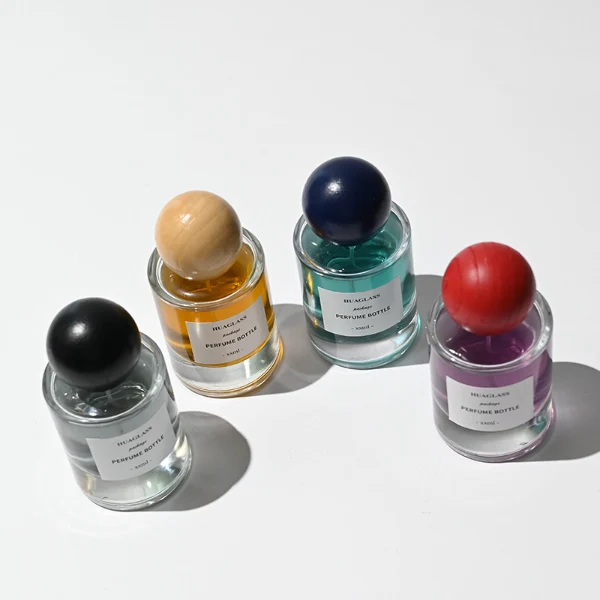 HUA0200 perfume bottle, cylindrical matte solid-color sprayed glass body with 30 ml, 50 ml, or 100 ml liquid, spherical resin cap with marble pattern, private printed logo, modern luxurious design, ideal for gifting and daily use.