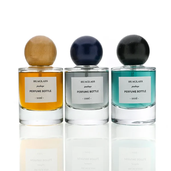 HUA0200 perfume bottle, cylindrical matte solid-color sprayed glass body with 30 ml, 50 ml, or 100 ml liquid, spherical resin cap with marble pattern, private printed logo, modern luxurious design, ideal for gifting and daily use.