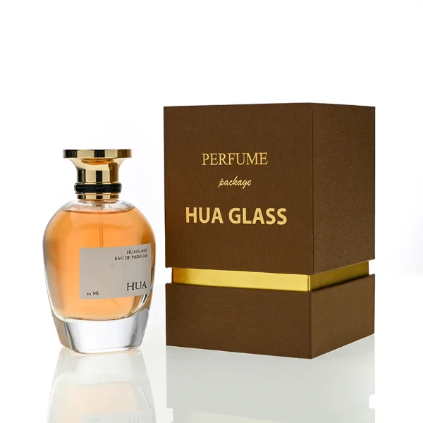 HUA0204 perfume bottle, flattened rounded streamlined transparent glass body with thick base and high-gloss finish, 100 ml liquid, flat cylindrical Zamac cap with slightly enlarged flat top fitting snugly on the neck, printed logo label, modern luxurious design, ideal for gifting and daily use.