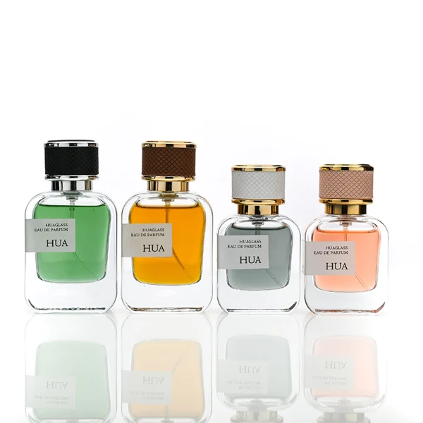 HUA0207 perfume bottle, rectangular transparent glass body with thick base, 30 ml, 50 ml, or 100 ml liquid, cylindrical leather-wrapped cap with customizable colors, brand label applied on the surface, modern luxurious design, ideal for gifting and daily use.