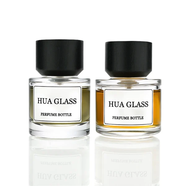 HUA0209 perfume bottle, cylindrical transparent glass body with thick base, 30 ml, 50 ml, or 100 ml liquid, cylindrical wooden cap with smooth matte finish, brand label applied on the surface, modern minimalist luxury design, ideal for gifting and daily use.
