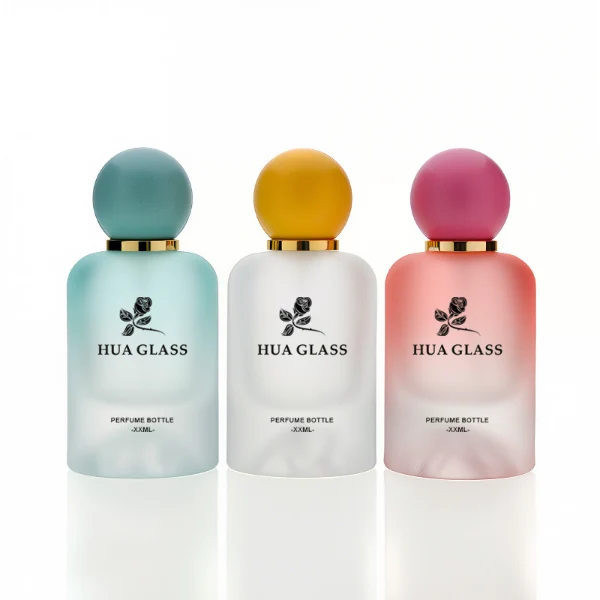 HUA0212 perfume bottle, rounded cylindrical frosted glass body with thick base, 30 ml, 50 ml, or 100 ml liquid, spherical plastic cap in customizable colors with gold neck ring, brand logo printed on the bottle, modern playful luxury design, ideal for gifting and daily use.