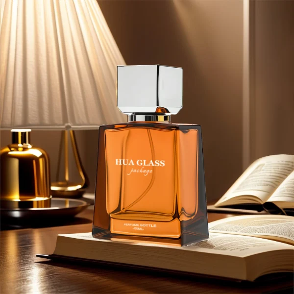 HUA0215 perfume bottle, square transparent glass body with thick base, 50 ml or 100 ml liquid, square plastic cap with customizable metallic finish, printed brand logo, modern minimalist luxury design, ideal for gifting and daily use.