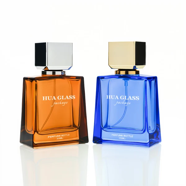 HUA0215 perfume bottle, square transparent glass body with thick base, 50 ml or 100 ml liquid, square plastic cap with customizable metallic finish, printed brand logo, modern minimalist luxury design, ideal for gifting and daily use.