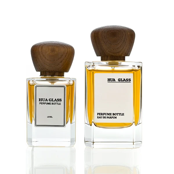 HUA0217 perfume bottle, square transparent glass body with thick base, 30 ml, 50 ml, or 100 ml liquid, rounded wooden cap, brand label applied on bottle, modern luxurious fashion design, ideal for gifting and daily use.