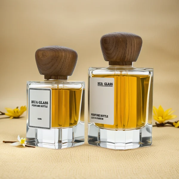 HUA0217 perfume bottle, square transparent glass body with thick base, 30 ml, 50 ml, or 100 ml liquid, rounded wooden cap, brand label applied on bottle, modern luxurious fashion design, ideal for gifting and daily use.