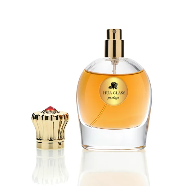 HUA0220 perfume bottle, rounded transparent glass body with thick base, 80 ml liquid, decorative Zamac cap with flat cylindrical top or petal-shaped dome top, brand label applied on bottle, modern luxurious fashion design, ideal for gifting and daily use.