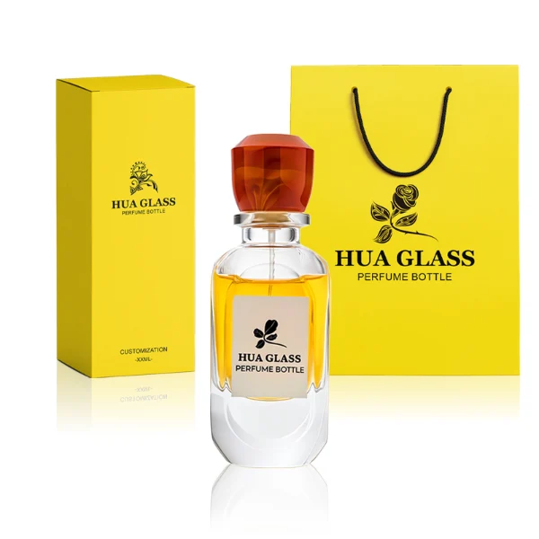 HUA0222 perfume bottle, rounded rectangular transparent glass body with thick base, 80 ml liquid, faceted resin cap with natural marbled pattern and customizable color, brand label applied on bottle, modern luxurious fashion design, ideal for gifting and daily use.