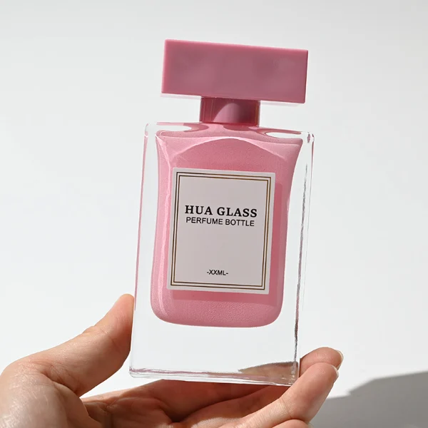 HUA0223 perfume bottle, rectangular inner-sprayed glass body with thick base, 30 ml, 50 ml, or 100 ml liquid (pink or black), rectangular flat plastic cap, brand label applied on bottle, modern luxurious fashion design, ideal for gifting and daily use.