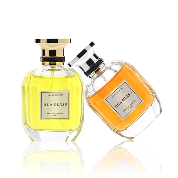 HUA0224 perfume bottle, multifaceted transparent glass body with thick base, 100 ml liquid, cylindrical plastic cap with slightly flared flat top and gold or silver neck ring, brand label applied on bottle, modern luxurious fashion design, ideal for gifting and daily use.