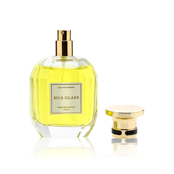 HUA0224 perfume bottle, multifaceted transparent glass body with thick base, 100 ml liquid, cylindrical plastic cap with slightly flared flat top and gold or silver neck ring, brand label applied on bottle, modern luxurious fashion design, ideal for gifting and daily use.