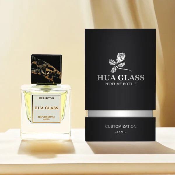 HUA0226 perfume bottle, square transparent glass body with thick base, 30 ml, 50 ml, or 100 ml liquid, square natural stone cap with customizable color and organic stone texture, brand label applied on bottle, modern luxurious fashion design, ideal for gifting and daily use.
