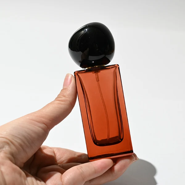 HUA0227 perfume bottle collection, rectangular glass bottles with customizable transparent, colored, or gradient finish, 30 ml, 50 ml, or 100 ml liquid, four distinct plastic cap styles including geometric, square cylindrical, rounded, and metallic square designs, modern luxurious fashion style, ideal for gifting and daily use.