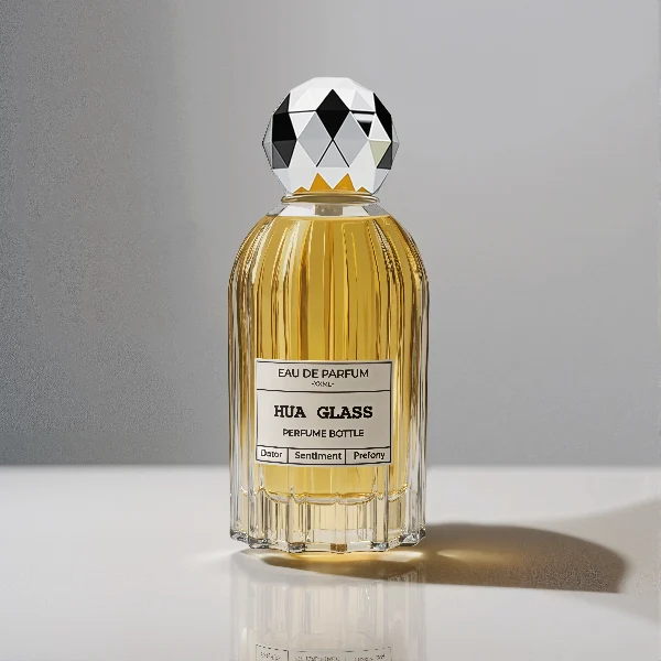 HUA0229 perfume bottle, cylindrical transparent glass body with ribbed sides and thick base, 100 ml liquid, faceted geometric sphere plastic cap in gold or silver, brand label applied on bottle, modern luxurious fashion design, ideal for gifting and daily use.