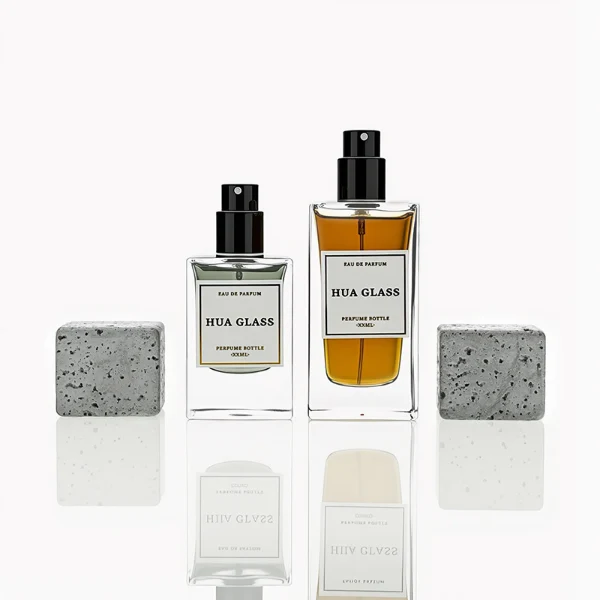 HUA0230 perfume bottle, rectangular transparent glass body with thick base, 30 ml, 50 ml, or 100 ml liquid, square artificial stone cap with natural texture, brand label applied on bottle, modern luxurious fashion design, ideal for gifting and daily use.
