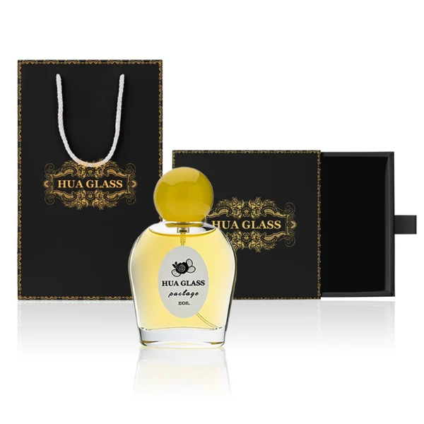 HUA0232 perfume bottle, flattened oval transparent glass body with thick base, high-gloss finish, smooth rounded contours, 50 ml liquid, spherical plastic cap in customizable colors, brand label applied on bottle, modern playful design, ideal for gifting and daily use.
