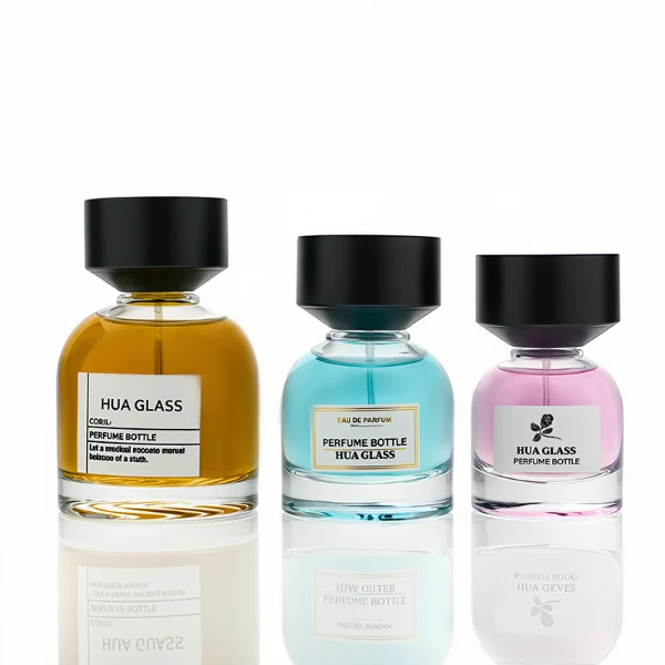 HUA0234 perfume bottle, flattened oval transparent glass body with thick base and smooth rounded contours, 30 ml, 50 ml, or 100 ml liquid, cylindrical plastic cap with flat top, brand label applied on bottle, modern luxurious design, ideal for gifting and daily use.